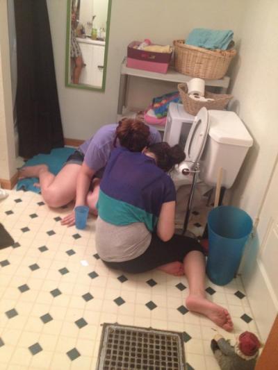 College students puking in toilet