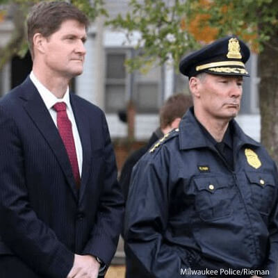 District attorney John Chisholm (left)