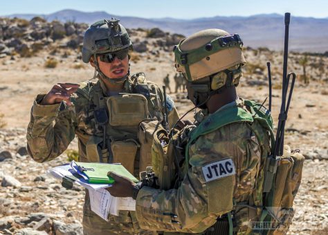 Two Air Force JTACs discuss mission parameters prior to calling in CAS