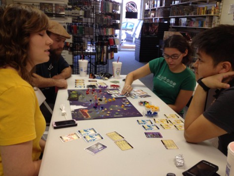 Boys and girls playing the famous co-operative board game