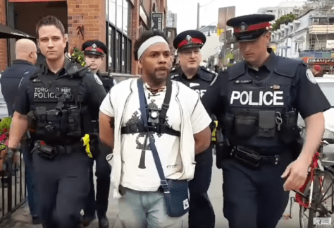 Four white Canadian police officers arrest black pastor